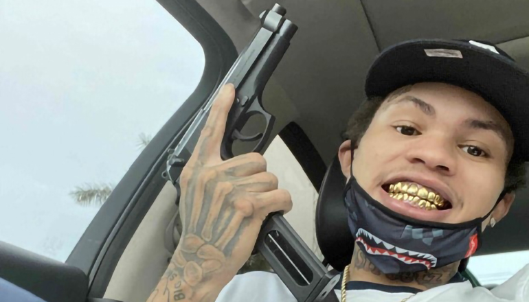 gang member with gun